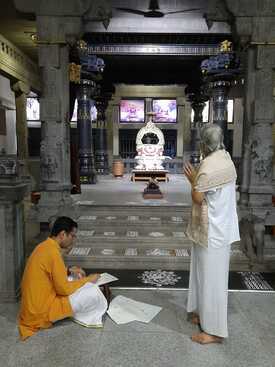Signing of documents at the Shrine of Sri Ramana Maharshi