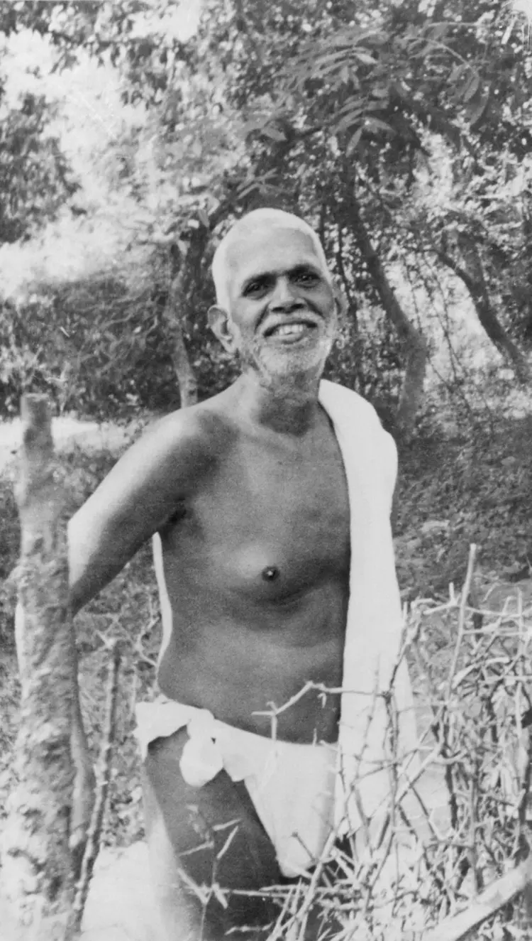 Ramana Standing, smiling