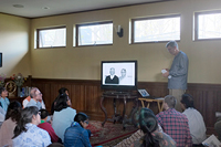 devotees watching the video presentation, image 1