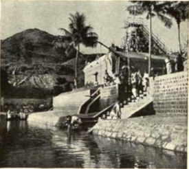 Bathing pool, on the ashrama is for Hindu religious ritual of washing In the background at the left is the sacred Arunachala on which Sri Ramana formerly lived.