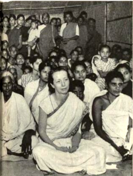Europeans and Americans as well as throngs of Hindu pilgrims. In the foreground center is Thelma Benn an american disciple born in San Francisco.