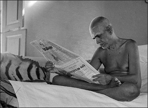 Bhagavan Reading the newspaper