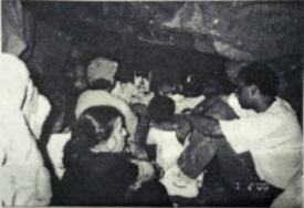 Children and parents chanting in<br>the Ashrama cave on North Mountain